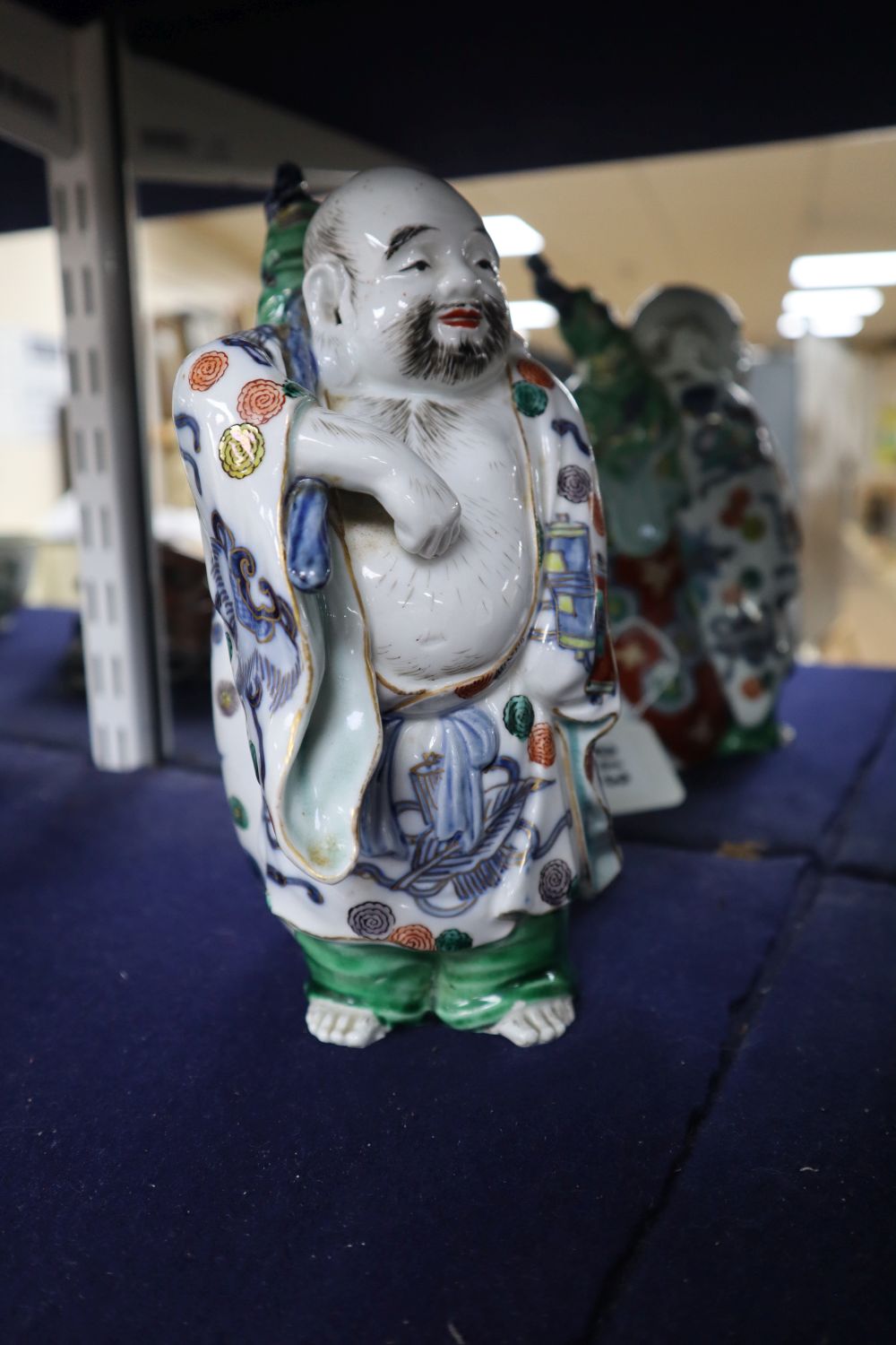 A Japanese Kutani figure of Hotei, 21cm